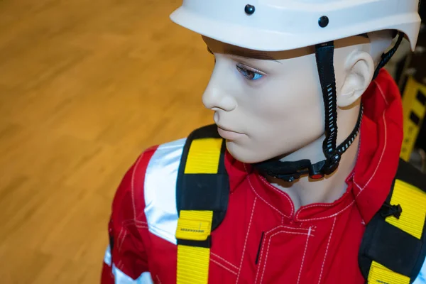 Protective helmet on a mannequin. Helmet for work at height and