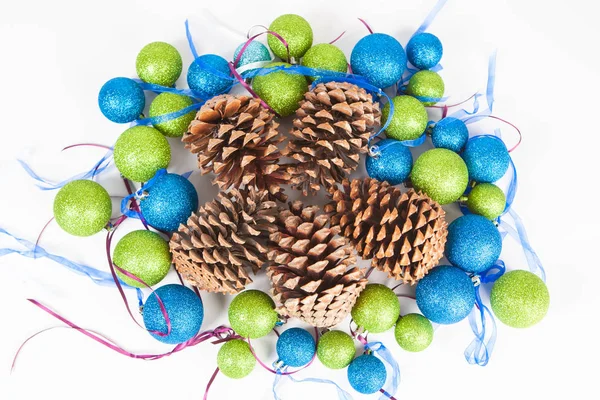 Christmas decorations. Balloons. Colored balls for decoration. Cones. New Year decoration. Cedar cones. Decorations for Christmas.