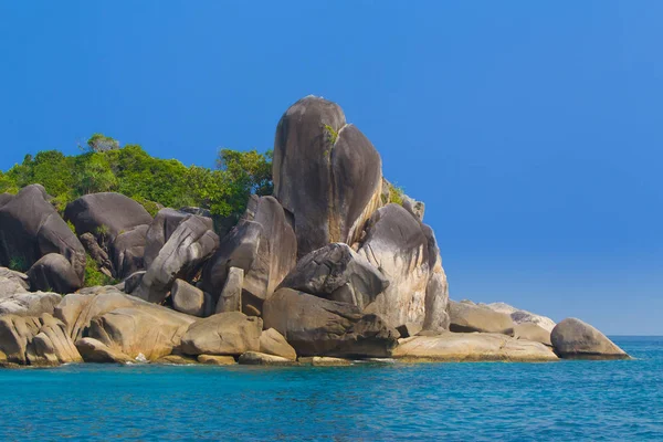 Thailand. The island of Phuket. Rocks in the Andaman Sea. Huge stones along the shore. The nature of Thailand. Islands in the Indian Ocean.