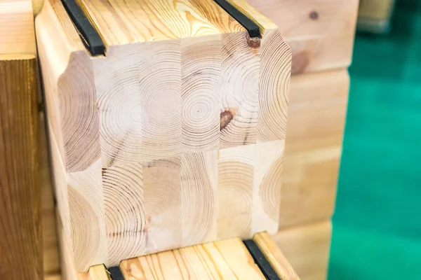 Glued beams. The house is made of laminated wood. Building materials made of wood. — Stock Image Glued beams. The house is made of laminated wood. Building materials made of wood. Stock Picture
