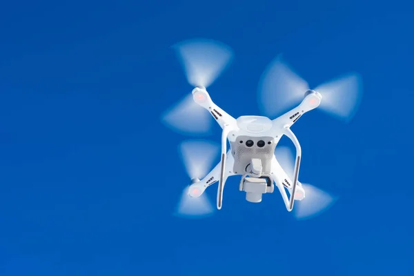 Unmanned aerial vehicle. Soaring in the sky drone. Shooting at a