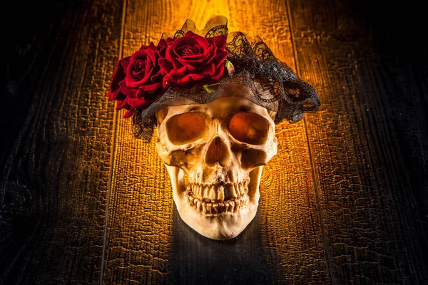 A skull with a wreath of roses. Roses on the skull. The day of the Dead