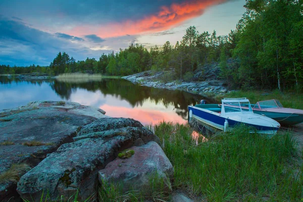 Karelia. Nature of Karelia. Russia. Ladoga lake. Boat off the coast. Northern nature. Islands on Lake Ladoga. The nature of Russia. Republic of Karelia. — Stock Image Karelia. Nature of Karelia. Russia. Ladoga lake. Boat off the coast. Northern nature. Islands on Lake Ladoga. The nature of Russia. Republic of Karelia. Stock Photo