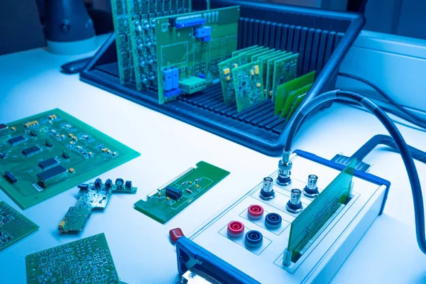 Electrical engineering.Workplace electronic engineer.Electronics manufacturing.Testing of electronic devices.Vertical storage of printed circuit boards.omponents for electronic devices.Chips