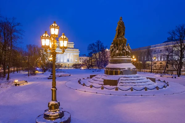 Beautiful lantern.Lantern light.City in winter.Snow in Petersburg.Ostrovsky square.Monument to Catherine in the snow. Square at the Alexandrinsky theatre. Winter twilight. Winter impressions of Russia