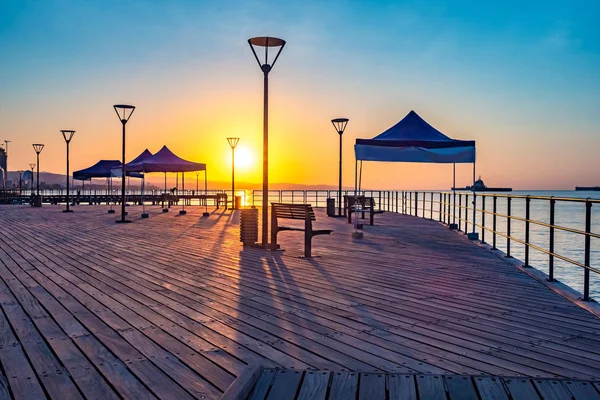 Republic of Cyprus. Limassol. Sunset on the Mediterranean sea. Deserted promenade of Limassol in the evening. The sun sets. View of the Bay at sunset. Evening landscape of Cyprus.