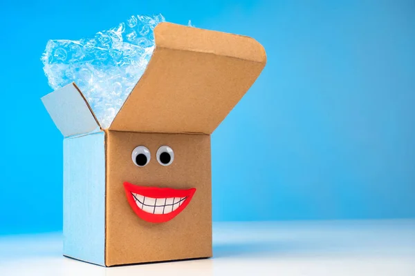 Emoji box. Packing of goods. Cardboard boxes. Delivery of purchases home. Positive emotions from shopping. Box with bubble wrap. Delivery service. boxes for moving. Cardboard packaging materials