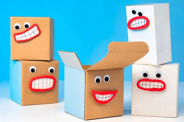 Emoji box. Packing of goods. Cardboard boxes. Delivery of purchases home. Positive emotions from shopping. Delivery service. boxes for moving. Cardboard packaging materials. Cardboard Faces