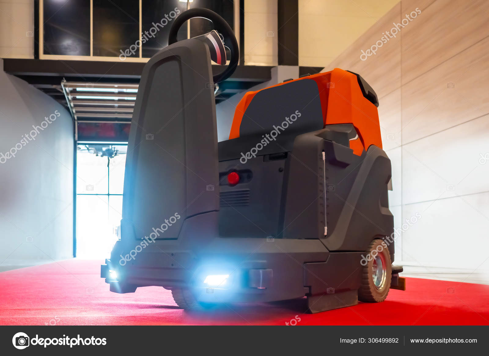 Scrubber with a seat for the operator. Automatic sweeper. Car for