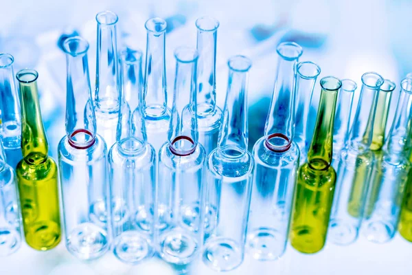 Test tubes for the laboratory. Glass flasks in medicine. Multi-colored test tubes for analysis. Sterilization of test tubes. Chemical experiments. DNA test. Experiments with reagents. Medical research