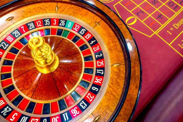 Casino. Game table with roulette. Games of chance. Croupier work