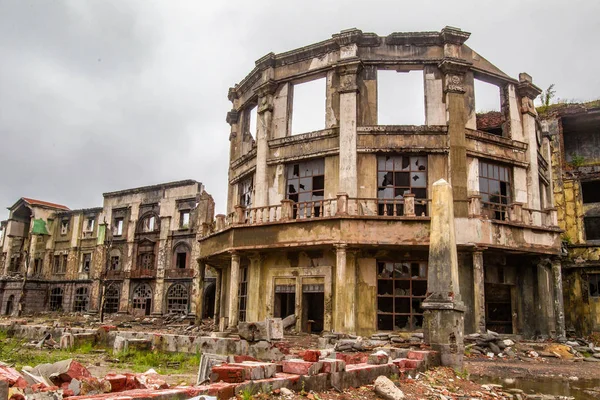 Ruined city. The Windows are broken. Deserted ruins of the city. Ruin. The post-war landscape. The buildings were destroyed during the raids.