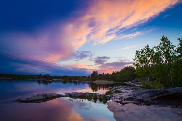 Russia. Panorama Of Karelia. Sunset over lake Ladoga. nature of Russia. Beautiful scenery. Bay of lake Ladoga. Rocky shore. Travelling to Karelia. — Stock Image Russia. Panorama Of Karelia. Sunset over lake Ladoga. nature of Russia. Beautiful scenery. Bay of lake Ladoga. Rocky shore. Travelling to Karelia. Stock Photo