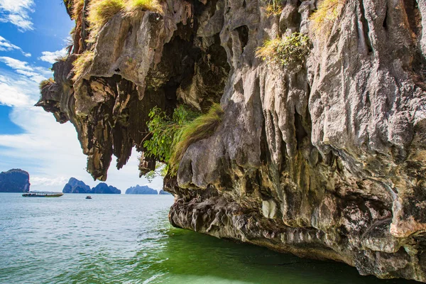 Bond Island in Thailand. Phuket. Boat in the Andaman Sea. Summer vacation in Thailand. Walking in Thailand. Islands of the Andaman Sea. Phang Nga Bay Rocks hung over the ocean. Traveling in Asia.