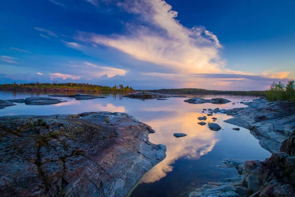 Karelia. Trip to Russia. Sunset over lake Ladoga. Rocky Islands of lake Ladoga. nature of Karelia. Rocky shore. Northern nature. Rest away from the city. — Stock Image Karelia. Trip to Russia. Sunset over lake Ladoga. Rocky Islands of lake Ladoga. nature of Karelia. Rocky shore. Northern nature. Rest away from the city. Stock Image