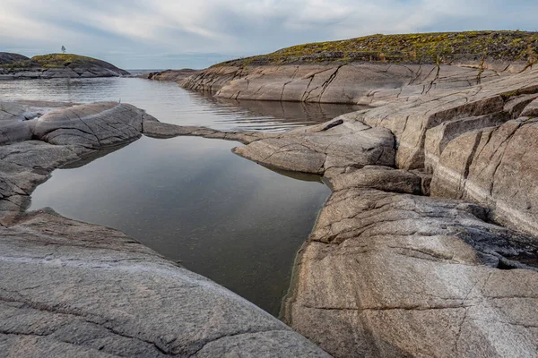 Karelia. Russia. Lakes of Karelia. Lake Ladoga. Landscapes of Karelia. The stone coast of Ladoga. Nature of northern Russia. Traveling in Russia. Rocky coast. Landscapes of the Russian Federation. — Stock Image Karelia. Russia. Lakes of Karelia. Lake Ladoga. Landscapes of Karelia. The stone coast of Ladoga. Nature of northern Russia. Traveling in Russia. Rocky coast. Landscapes of the Russian Federation. Royalty Free Stock Photos