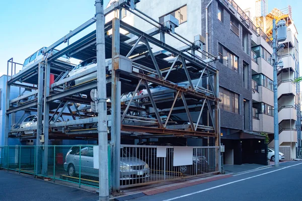 Japan. Multi-level Parking in Tokyo. Multi-storey car Park. Cars are parked in a Parking lot in a Japanese city. Automated Parking for cars. Saving urban space in Japan. Rational use of space.