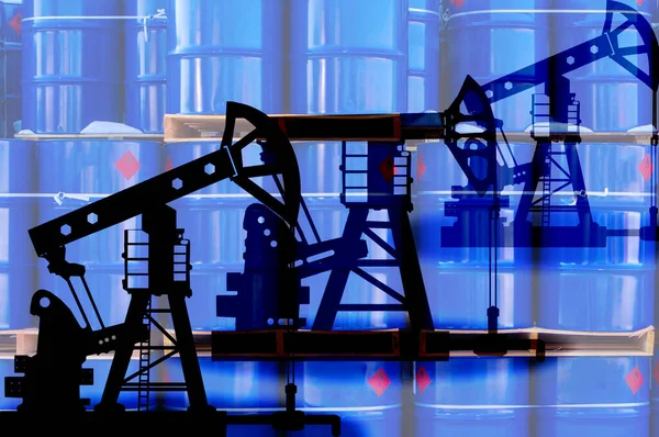 Oil rigs and blue barrels. Production and sale of crude oil. Oil production enterprise. Petroleum market. Concept of extraction and sale of natural resources.