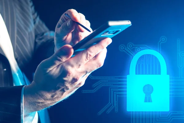 Protecting information when using a mobile phone. Personal data protection. Law on personal data protection. Hands of a man with a smartphone next to the image of the lock.