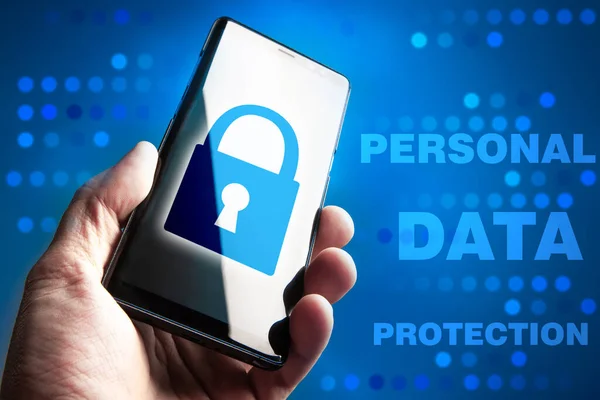 The text of the personal data Protection next to the smartphone. The smartphone screen shows a lock. Security. Data protection. Blocking information. The preservation of private data.