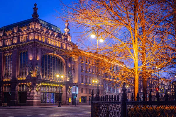 Saint Petersburg in the evening. Cities of Russia. Nevsky Prospect in the light of lanterns. Eliseevsky store in St. Petersburg. The Eliseevsky shop. Evening city in the light of lanterns.