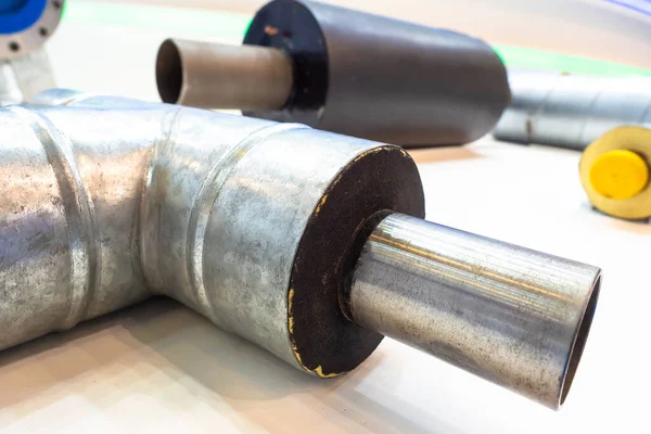 Metal pipe with insulation. Thermal insulation of pipes. Pipes for heating and water supply networks. Protection of pipes from adverse natural factors.