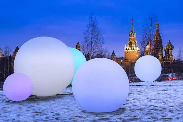 Moscow. Russia. Park zaryadye on a winter night. Large balls in front of the Kremlin. Snow in the Moscow park. The surroundings of the Kremlin on Christmas night. New Year decorations.