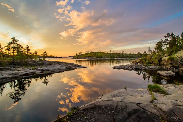Lake in Karelia. Russia. Lake Ladoga at dawn. Nature regions of Russia. Skers of Lake Ladoga. Tourism Russia. Landscapes of Northern Nature. Rocky coast of Ladoga. Guide to Karelia. Russian north — Stock Image Lake Karelia Russia Lake Ladoga Dawn Nature Regions Russia Skers Stock Photo