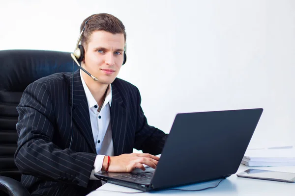 Customer support agent. User support operator on white background. Call center operator. Man with headset works on laptop. Customer on phone call consultation. Concept - career support agent.