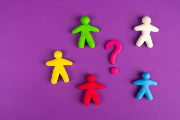 Problems in the team. Individual colored men and a question mark next to them. Disagreements in the team. The problem of human relations. The concept of solving business problems.
