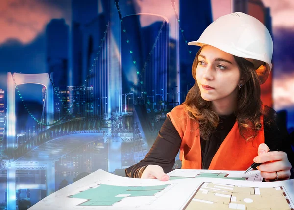 Architect girl on the background of the evening city. Work on a construction project. Convenient urban infrastructure. A female construction engineer imagines future buildings and structures.