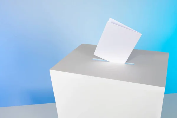 Ballot box and ballot paper on a blue background. Voting in elections. Opinion poll. The national referendum. State elections.