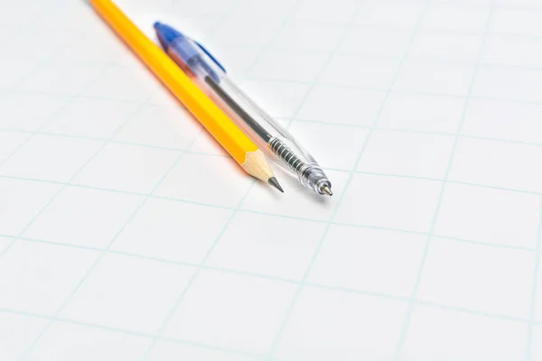 Yellow Pencil Blue Pen White Paper — Stock Photo, Image