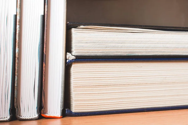 School books for education lie on the shelf.