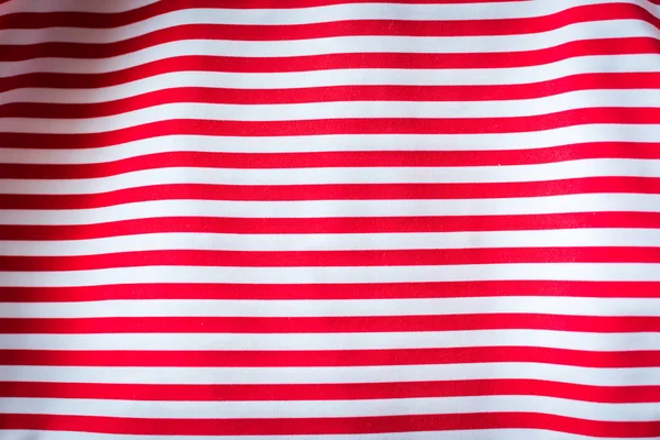 Полосатая красно-белая полосатая ткань, фон . — стоковое фото