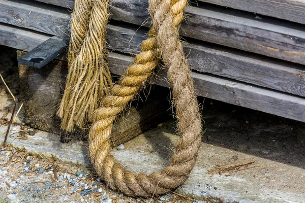 Thick rope to tie ship with a dock.