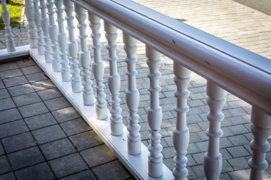Wood stair railing.  at daytime 