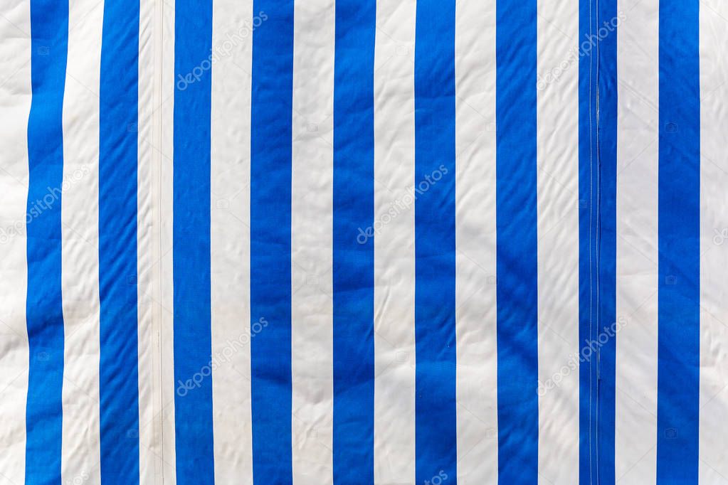 Striped awning in white blue striped, background
