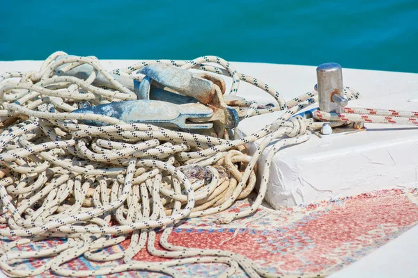 White cable for tying lies on board boat.