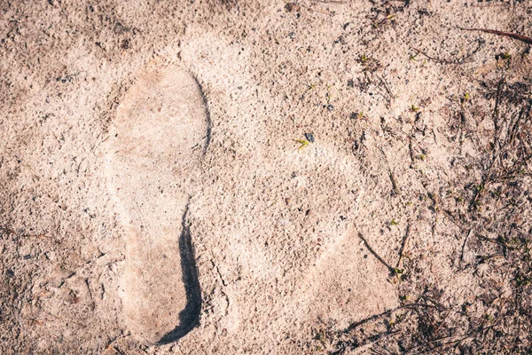 Voetafdruk op het zand van de womens boot. — Stockfoto