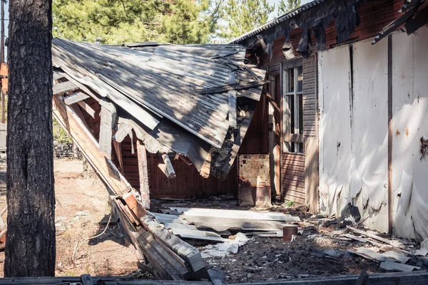 Old ruined house after long standing with collapsed walls and windows. — Stock Photo, Image