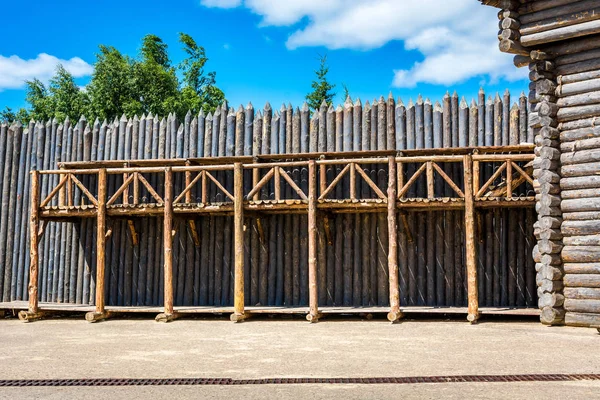Medieval wooden fence made of palisade — Stock Photo, Image