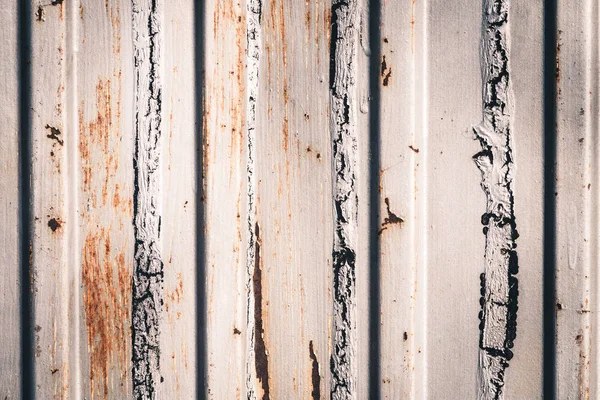 Rusty metal fence of corrugated flooring. Rear background. — Stock Photo, Image