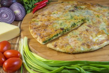 Traditional homemade Ossetian cake with green onion.