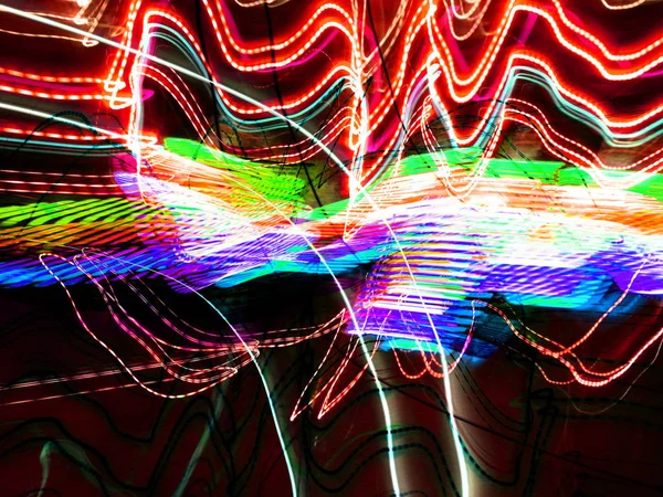 Light painting. Neon glow. Abstract blurred background. Colorful pattern.