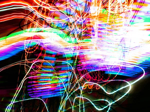 Light painting. Neon glow. Abstract blurred background. Colorful pattern.