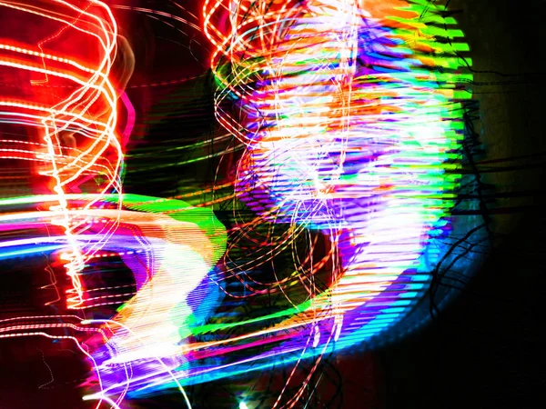 Light painting. Neon glow. Abstract blurred background. Colorful pattern.