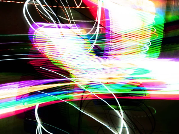 Light painting. Neon glow. Abstract blurred background. Colorful pattern.