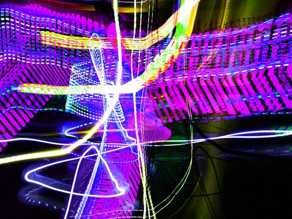 Light painting. Neon glow. Abstract blurred background. Colorful pattern.