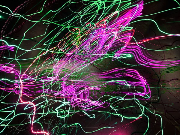 Light painting. Neon glow. Abstract blurred background. Colorful pattern.